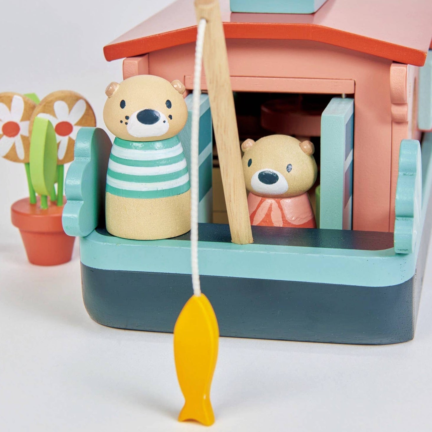 Little Otter Canal Boat, Introducing the Little Otter Canal Boat, where our adorable wooden otter doll family resides. This beautiful canal boat, named "Malardeau" after their favorite mallard duck, is a delightful addition to our wooden toy range.The removable roof and lift-out cabin provide extra play space and make this doll's house boat perfect for imaginative playtime. The Little Otter Canal Boat set also includes a variety of accessories designed to support language development, emotional awareness, a