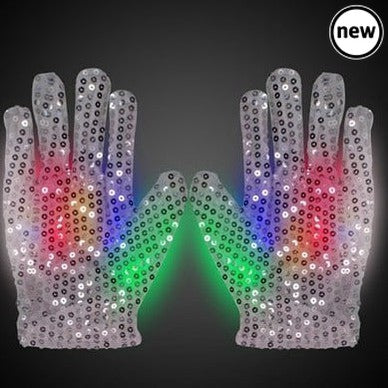 Magic Sensory Gloves, Transform your sensory playtime into a mesmerizing experience with Light Up Magic Sensory Gloves. These gloves are designed to captivate your imagination by allowing you to create crazy streaking patterns with your hands in the dark. Each finger and thumb is equipped with a built-in array of 3 LEDs in red, green, and blue, resulting in a total of 15 LEDs per glove. Magic Sensory Gloves Features: Sensory Magic: These gloves are all about sensory stimulation. The LEDs at your fingertips 