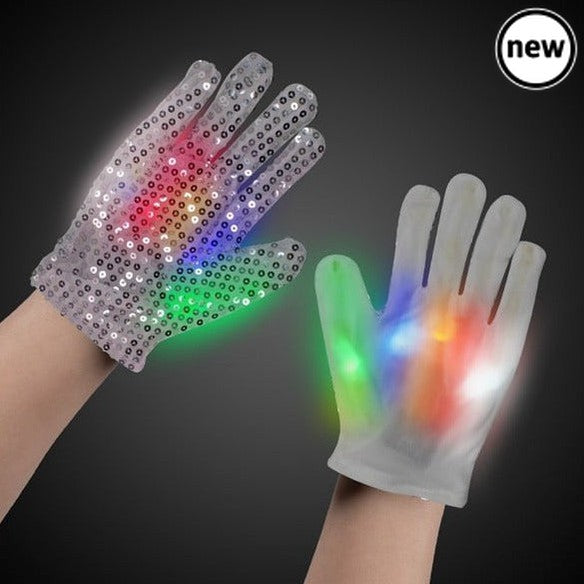 Magic Sensory Gloves, Transform your sensory playtime into a mesmerizing experience with Light Up Magic Sensory Gloves. These gloves are designed to captivate your imagination by allowing you to create crazy streaking patterns with your hands in the dark. Each finger and thumb is equipped with a built-in array of 3 LEDs in red, green, and blue, resulting in a total of 15 LEDs per glove. Magic Sensory Gloves Features: Sensory Magic: These gloves are all about sensory stimulation. The LEDs at your fingertips 