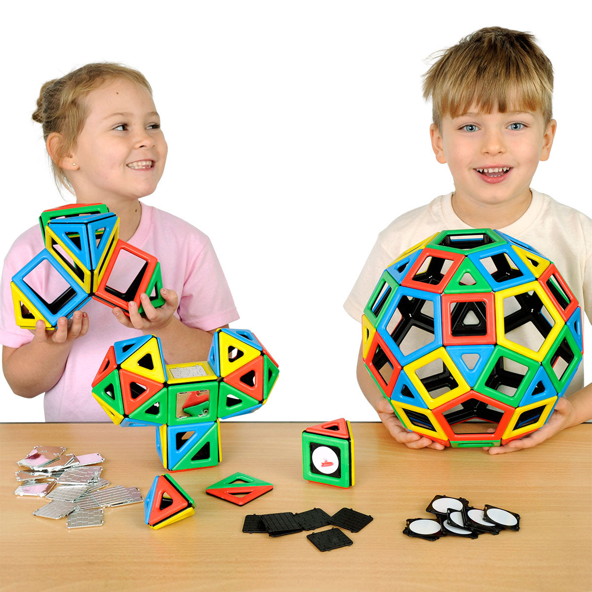 Magnetic Polydron Super Class Set, Take your magnetic construction to the next level with the Magnetic Polydron Super Class Set. This comprehensive and versatile set is perfect for any classroom or playgroup, providing endless opportunities for hands-on learning and creative exploration.Containing a whopping 184 pieces, this set offers a wide variety of shapes to work with. Included in the set are 36 squares, 60 equilateral triangles, 24 right angle triangles, 12 rectangles, 12 pentagons, 20 mirror panels, 