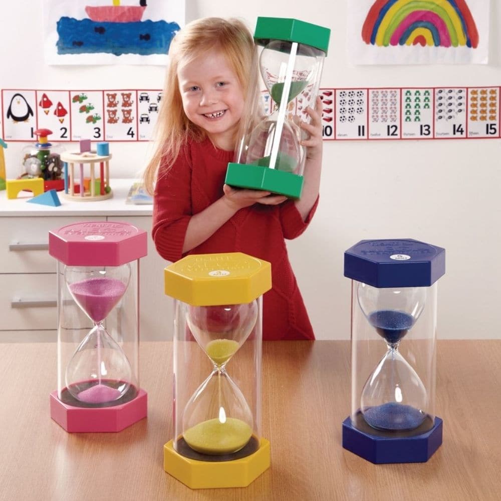 Mega Sand Timer 1 Minute, These Mega sand timers are probably the largest sand timers in existence at 300mm in height. The Mega sand timer counts for 1 minute and is visually stunning and perfect for use in a classroom setting. The Mega sand timers have large moulded end caps and thick protective walls which allow for safe and easy handling. A modern hourglass design inside a safe shatterproof plastic container. The movement of the colourful sand captures your child's attention and allows them to visualise 