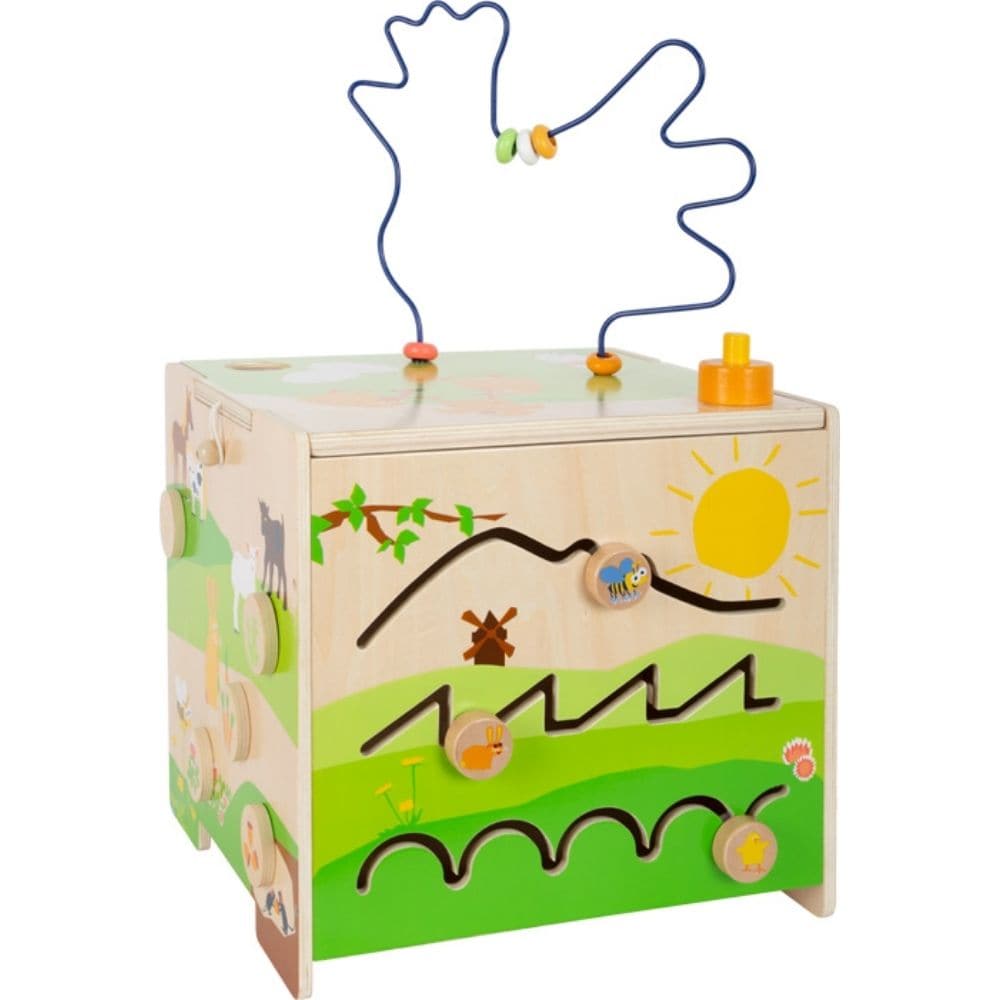 Motor Activity Cube Country Life, There's a lot going on in the country! With a large bead maze in the shape of a chicken, a shape-fitting game, a sliding labyrinth, a colour sorting game, a hammer marble run, and a horn, this motor activity cube is a multi-talent on five actively playable spaces. The lovingly designed scene with farm animals inspires interaction and storytelling. When the lid that's secured with a latch is turned around and stored inside the cube, the cube becomes a children's stool! Who e