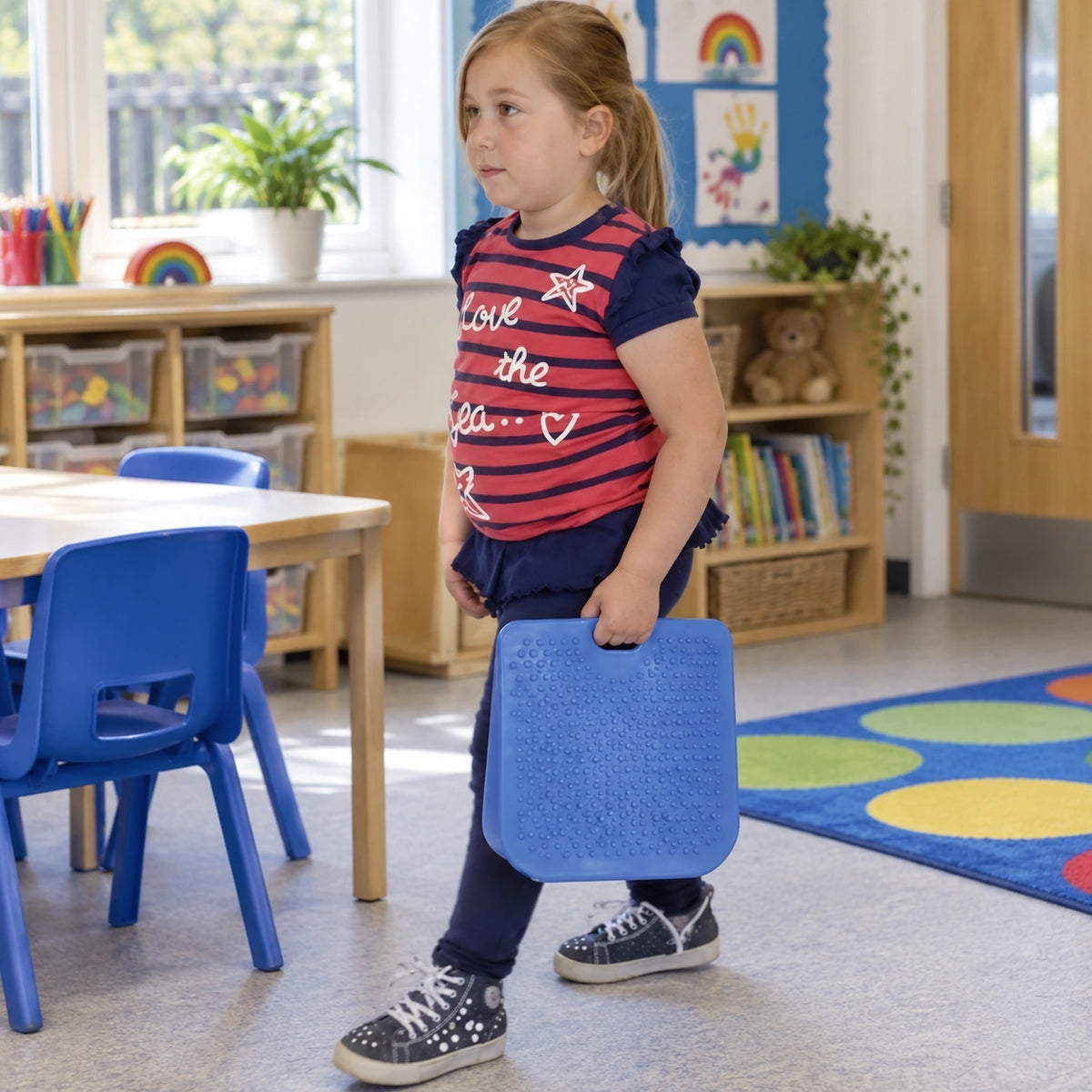 Move and Sit junior blue seat wedge in natural learning setting, view 3