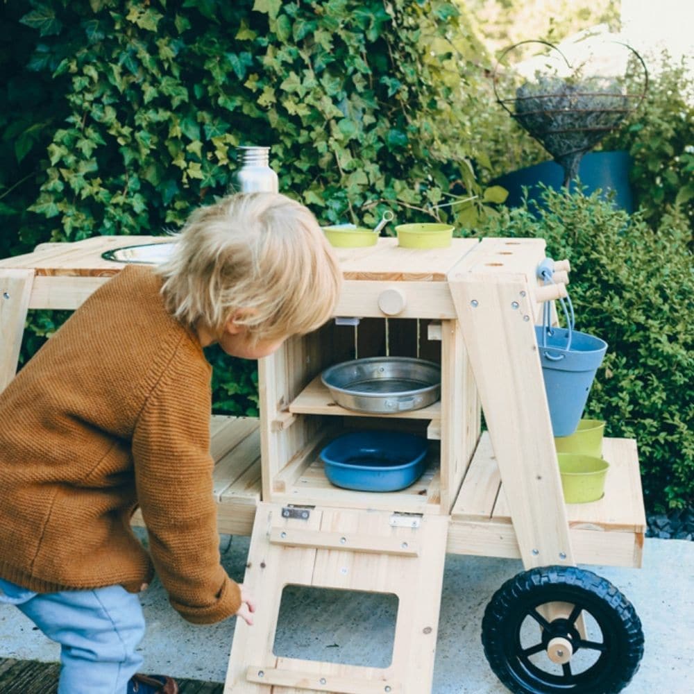 Mud Kitchen, Thanks to the indestructible wheels, the Mud Kitchen can be pushed around as much as the children want! The Mud Kitchen has an oven two knobs that make clicking sounds, a large mud bowl, two small mud pots and two flower pots made of metal as well as recesses, hooks, and a storage surface for organising gardening tools, cooking equipment and mud utensils make this extraordinary "summer kitchen" complete! This mud kitchen invites children to play in the mud to their hearts' content. The oven rep