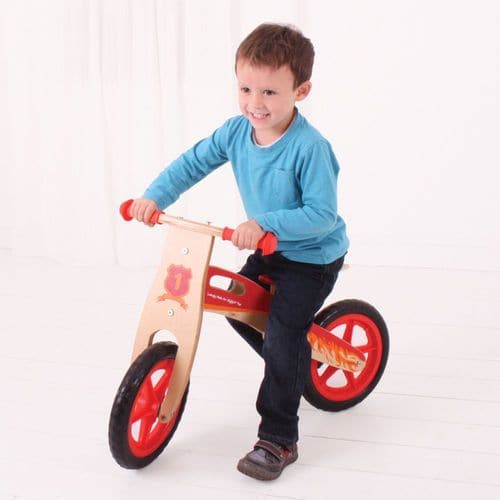 My First Balance Bike Red, This wooden Red Balance Bike is a great way for youngsters to start a journey towards full two-wheeled mobility! The Red Balance Bike features a padded, adjustable seat, long lasting solid tyres and easy to grip handle bars. Just push forwards and go! An excellent way to improve balance whilst further developing hand/eye co-ordination. Made from high quality, responsibly sourced materials. Conforms to current European safety standards. Suitable for kids aged 3 years and up. Weight