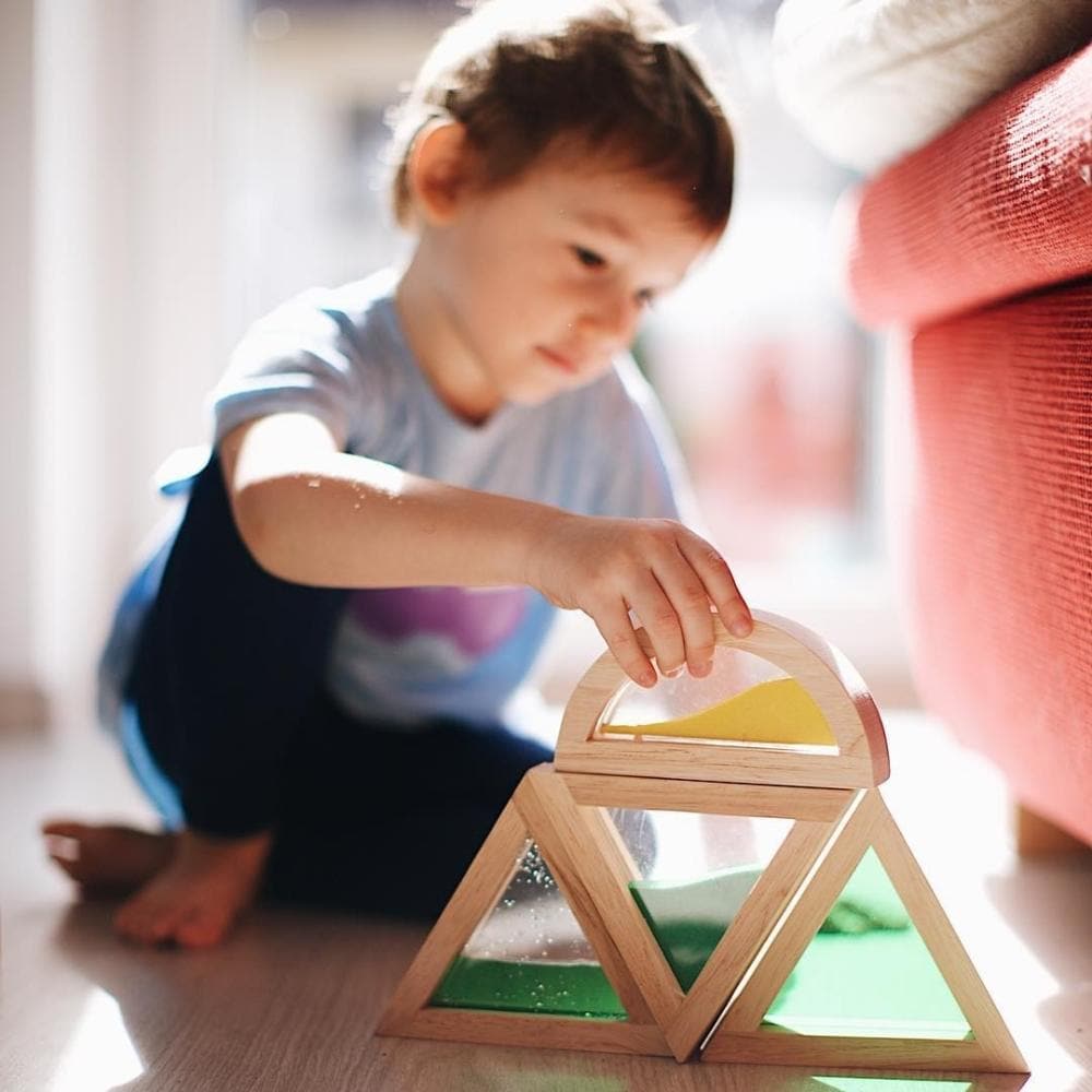 Natural Sensory Shapes, Journey into a world of tactile wonder with the Natural Shapes Sensory Toy. Crafted meticulously from natural wood and punctuated with vibrant windows, this toy promises not just playtime but an enriching multisensory experience. Our Natural Shapes Sensory Toy features natural wood and different brightly coloured windows. The various textures help develop kids’ dexterity as they learn to distinguish between the different sensations by touching and feeling. Look at the different sizes