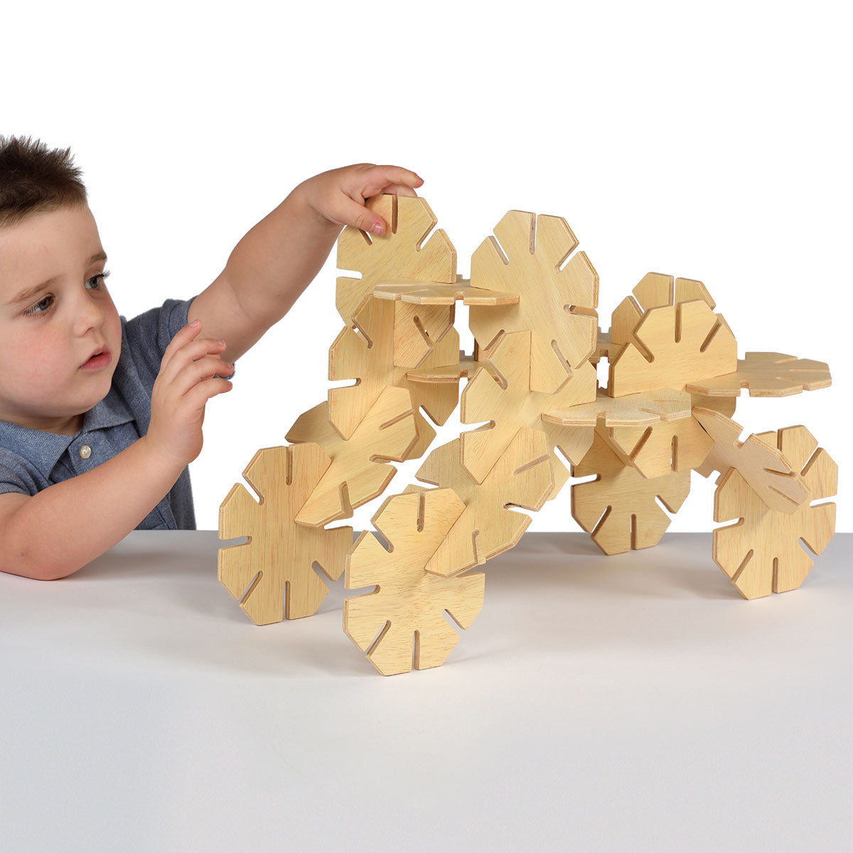 Natural Wooden Octoplay, Following the provided guide, children can create animals and patterns with these natural wood octagonal pieces. They're perfect for small hands, with an easy slot together feature. Unique octagonal wooden shapes which interlock to encourage creative construction play. This Natural Wooden Octoplay set of 20 unique wooden construction shapes can be used to create various models such as a person, a dog or a tower. Made from high quality plywood in a beautiful natural finish, the piece