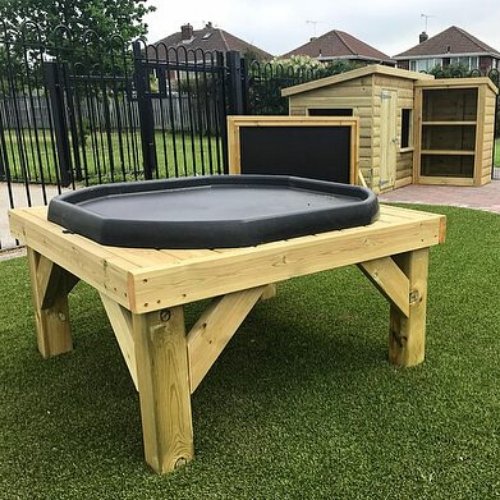 Nature Outdoor Play Table, The Nature Outdoor Play Table is designed to provide a fun and interactive play experience for small groups of children. With its spacious tuff tray on top, children can gather around and engage in various activities that promote creativity, imagination, and exploration.One of the main features of this play table is the ample space it provides for children to stand around and play with the activities set out for them. Whether it's collecting leaves, branches, and stones from the s
