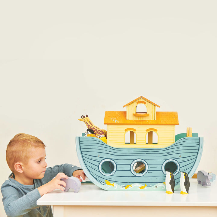 Noah's Great Ark, Noah's Great Ark is the perfect toy to engage young minds and foster imaginative play. This sustainable wooden toy is not only a beautiful addition to any playroom, but it also holds educational value.The Noah's Great Ark set includes a big, beautifully painted wooden ark that serves as the centerpiece of the playtime adventures. The ark features a sliding panel in the hull, allowing children to simulate the boarding and disembarking of the animals. The hinged front hatch further enhances 