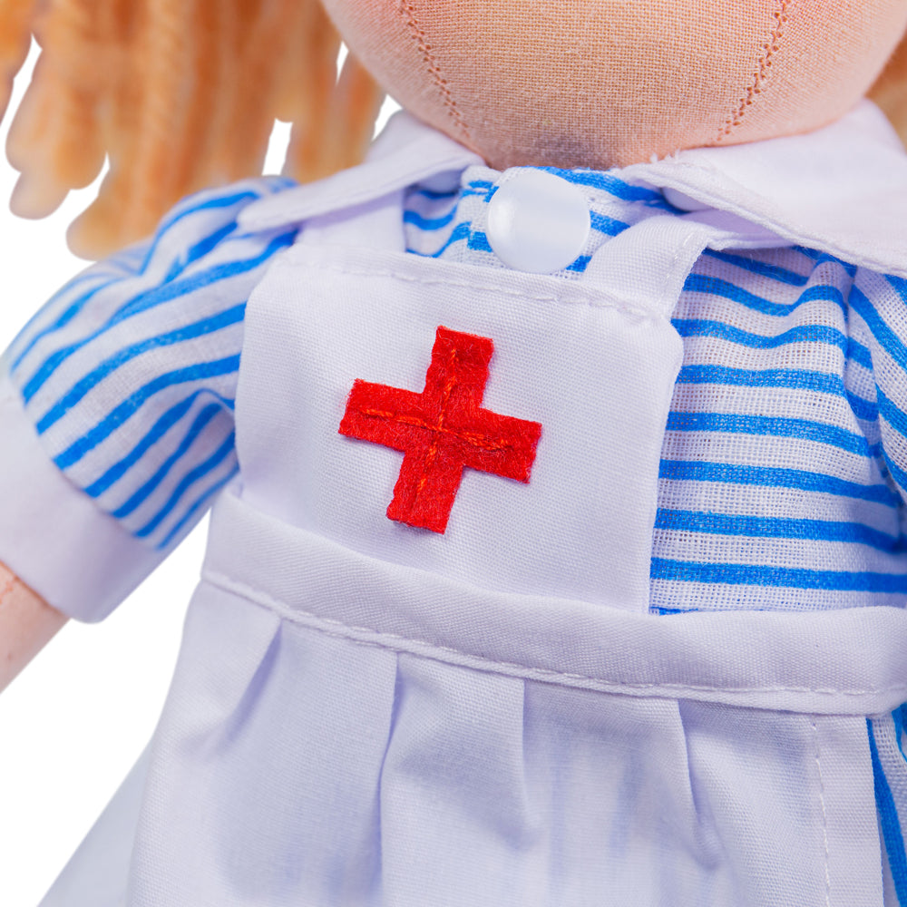 Nurse Nancy Doll - Small, Meet Nurse Nancy - this soft and cuddly ragdoll is calm in a crisis and ready for any emergency. A very dependable soft doll who loves a spot of drama, Nancy loves to share playtime fun with her friends when her shift is over. Nurse Nancy's soft material makes her the perfect toddler doll as she’s small (only 28cm tall) and gentle on little hands. Nancy the ragdoll can easily fit into bags, prams, cots, beds and cars so can be taken anywhere at any time! If your tot has a passion f