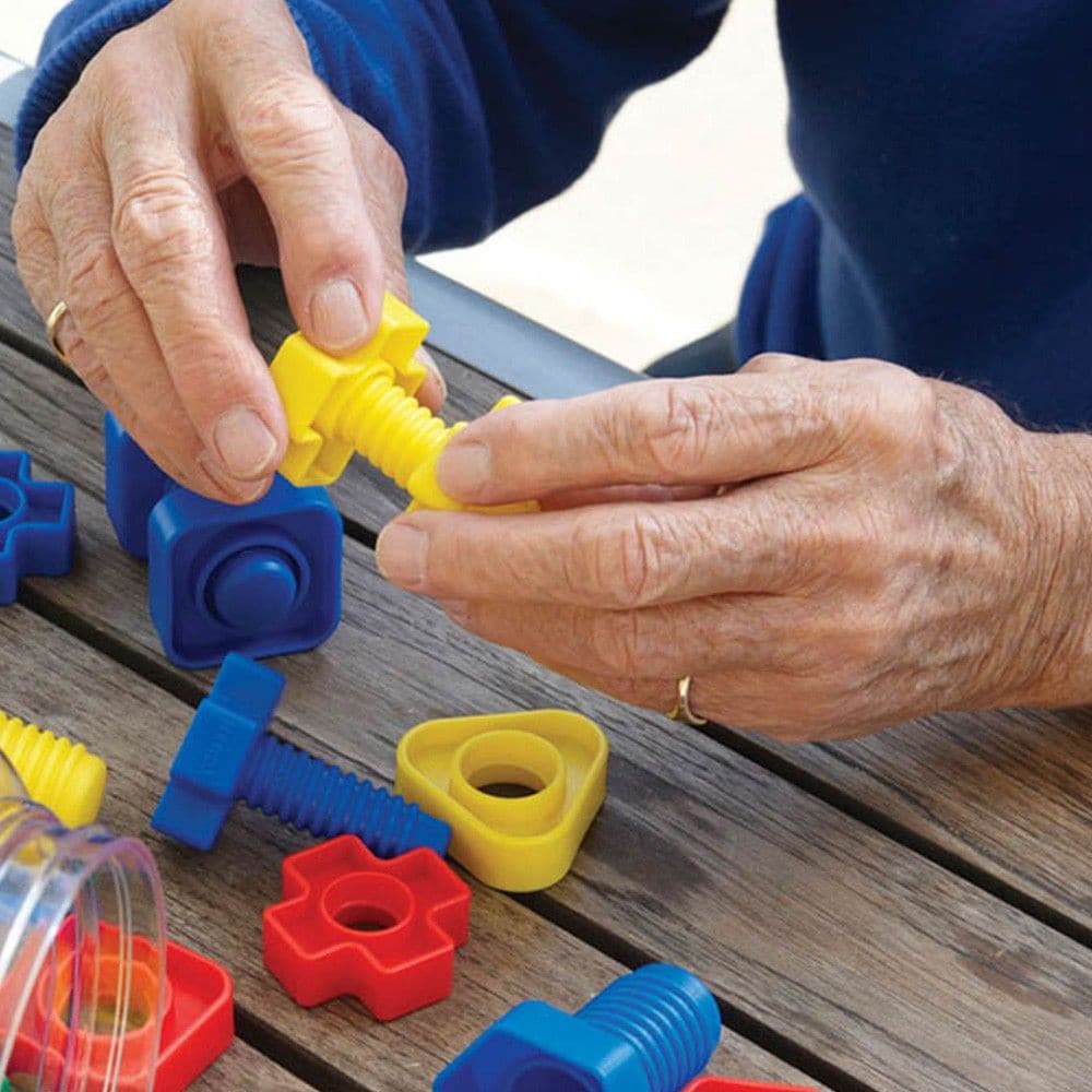 Nuts and Bolts Set 80 Pieces, These giant colour coded nuts and bolts are easy to hold and manipulate and they are excellent for developing hand-eye coordination and manipulation skills. The Nuts and Bolts set provides a great focus for fidgeting fingers to promote bilateral coordination, motor planning, eye-hand coordination and fine motor skills. The Nuts and Bolts Set is a great tool for sorting and counting too, different shapes will only work with their colours, so you can sort by colour and type. A pa