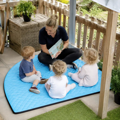 Outdoor Corner Mat educator-led story time under a nursery canopy