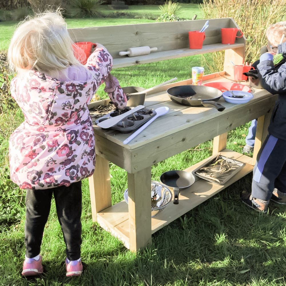 Outdoor Mud Pie Kitchen, This delightful Outdoor Mud Pie Kitchen will be a welcome addition to your existing messy play area. The outdoor mud kitchen contains a shelf underneath so you can store all your accessories during play. Messy play in outdoor mud kitchens is a crucial part of children's education. It fosters curiosity, imagination and exploration, practices good concentration and supports the ability to play independently or in groups, building positive relationships. Outdoor Mud Pie Kitchen Feature