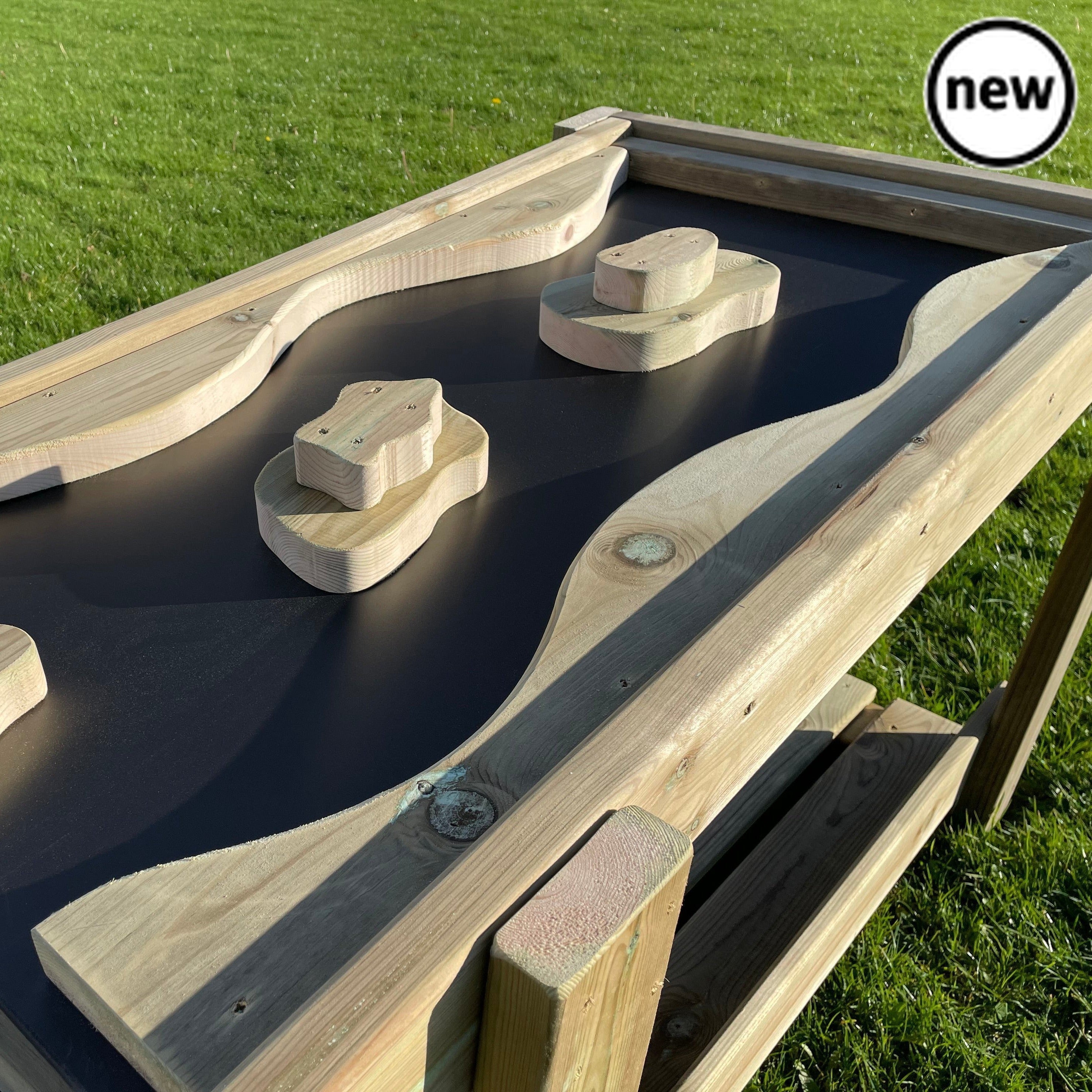 Outdoor Water Chute and Tuff Tray Table, Educational and fun! This exciting new resource will keep children entertained for hours, whilst providing them with educational benefits. An exciting way for children to learn about water fluidity as they watch the water run down the chute. With islands placed as obstacles along the chute to separate water flow, this resource would be great to use in a science lesson! A fun way to encourage teamwork on the playground. Made from sustainable FSC Pressure Treated Redwo