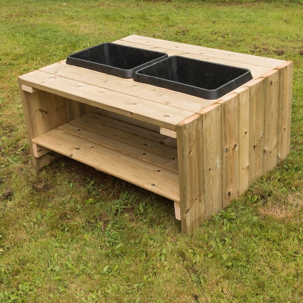 Outdoor Wooden Group Discovery Table, The Outdoor Wooden Group Discovery Table is a large outdoor wooden table with a storage shelf and plastic basins. The Outdoor Wooden Group Discovery Table has enough space for lots of children and table space to experiment. Children can transfer materials from one bowl to the other. Why not have a liquid in one tub, and a solid in another? The Outdoor Wooden Group Discovery Table allows children to experiment with multiple textures and forms. The basins remove for exten