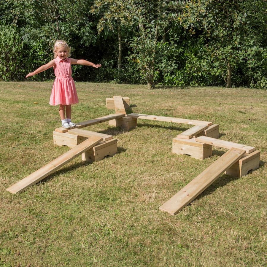 Outdoor Wooden Mini Adventure Trail 14pcs, Develop coordination and balancing skills with this wooden, outdoor balancing beam set. Create endless pathways and levels with this adaptable beam and block set. Change direction, length and height for multiple configurations. Use blocks and planks as loose parts play resources. This set is ideal for pack-away settings or smaller spaces, as it is lightweight and trails can be built in a variety of ways. Or why not create a balance trail around the edge of your out