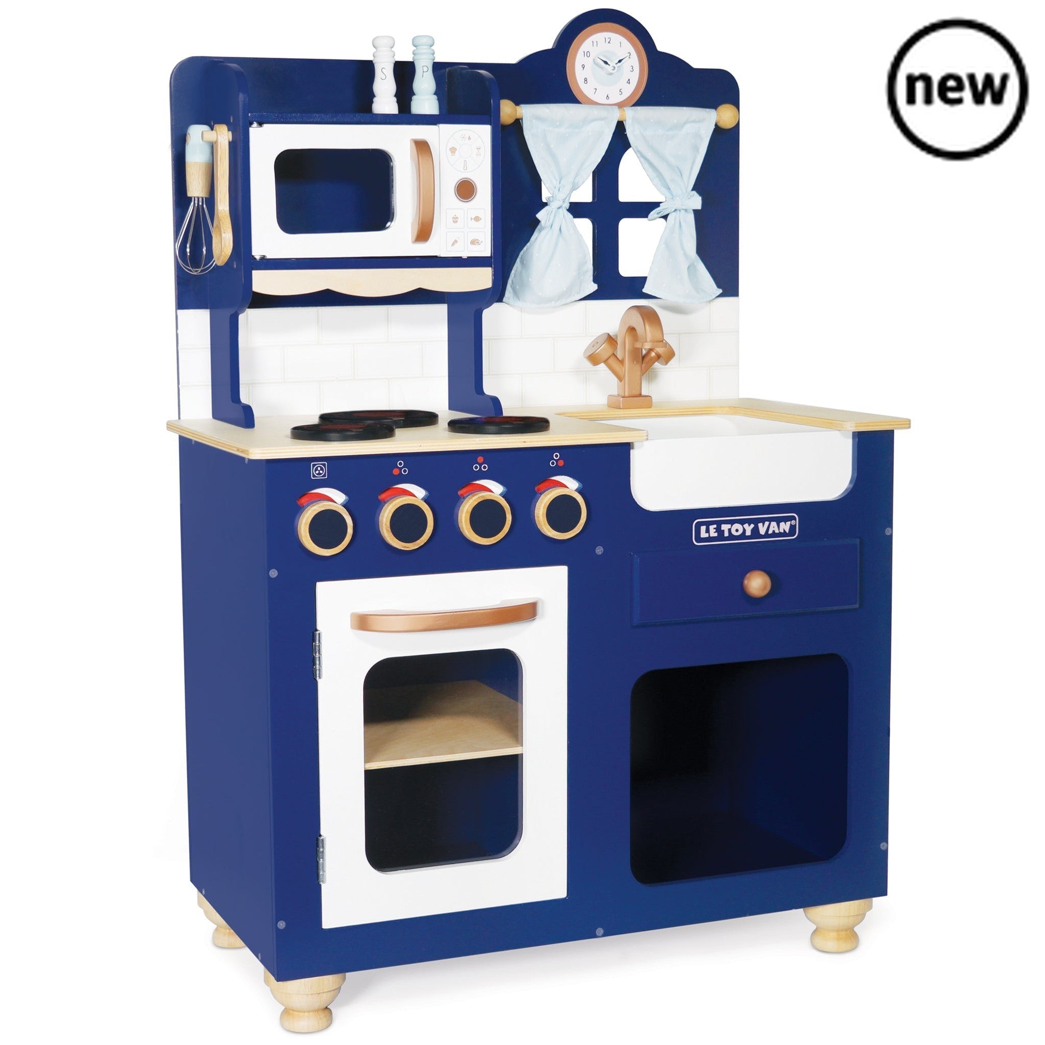 Oxford Toy Kitchen, Description Our award winning Oxford Kitchen is a real stunner. Made from durable, sustainable wood, it's eye-catching original design and beautiful craftsmanship make it a real showstopper! Painted in a striking royal blue colourway and finished with copper effect detailing, this traditional toy makes a great addition to the playroom or kids room and is ready for role play fun. Packed with delightful features, designed to promote extensive pretend play, including oven with opening door,