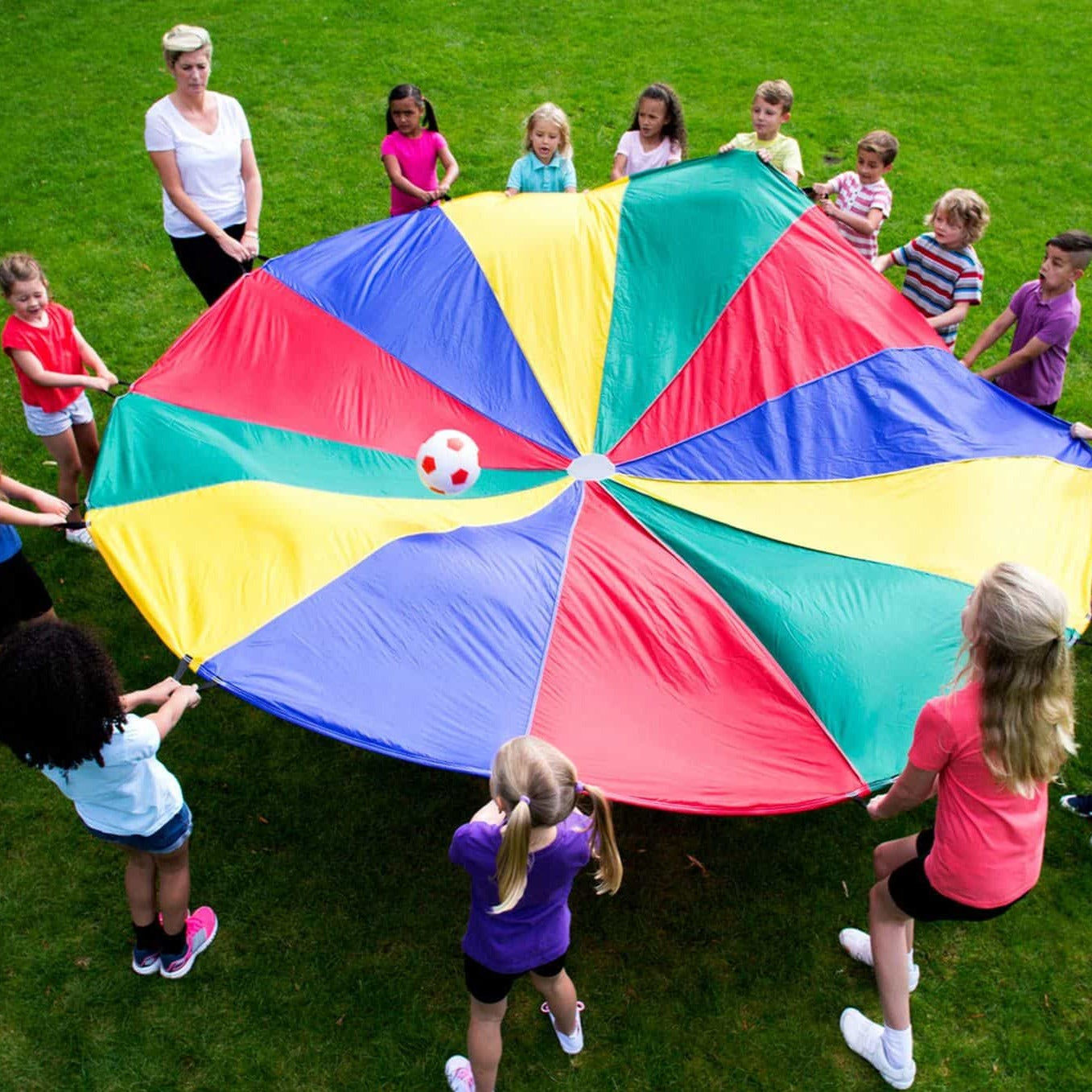 Parachute games 5.5 metre, Unveil a world of laughter, learning, and limitless fun with our 5.5 Metre Play Parachute! A delightful approach to encouraging skill development and physical coordination, this parachute is not just a play accessory but a catalyst for boundless joy and group interaction. 🌟 Full-Body Exercise: Engage every muscle and enjoy a hearty laugh as this play parachute offers a unique full-body workout, making it a fun exercise option for both kids and adults! 🤸 Promotes Coordination: Play
