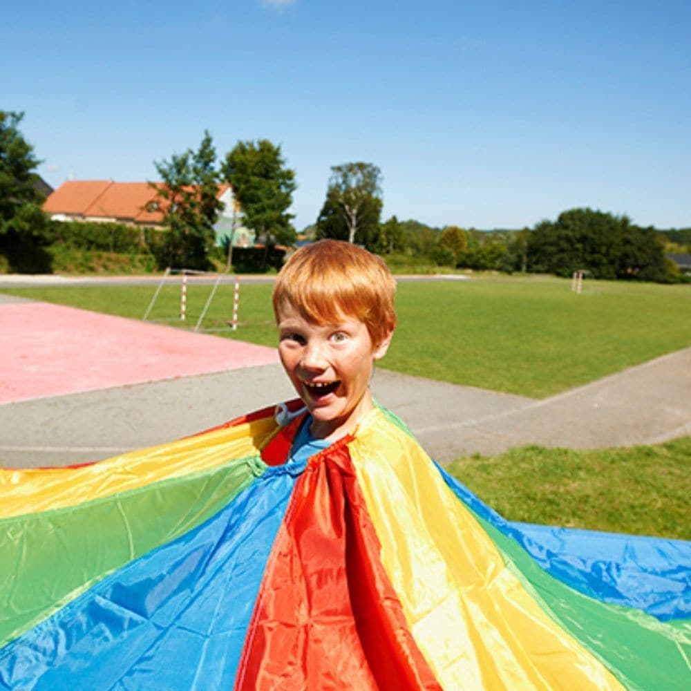 Parachute Games 7 metres, Parachute play is a novel and fun way of encouraging new skills and development. This 7 Metre Parachute is colourful and sometimes calming, it can create soft, whispering sounds, or loud rippling noises, depending on how quickly it is moved. Working together encourages co-operation, trust, communication and social skills. Parachute Games also encourage movement of muscles in the upper body. Games can involve touching the soft parachute fabric, moving or lying beneath or over it, an