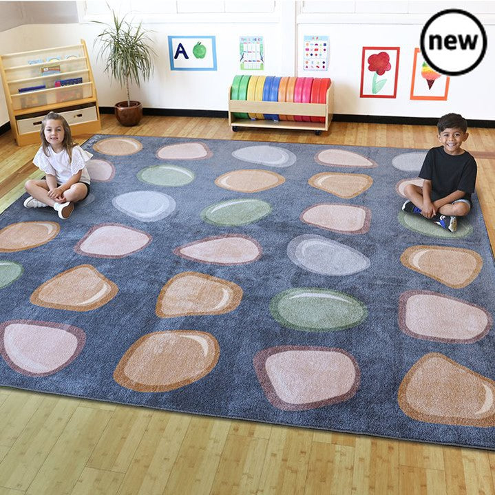 Pebble Placement Carpet 3m x 3m, Neutral pebble placement carpet, perfect for creating a calm environment in the classroom.With 30 pebble shaped placement spots making it ideal for seating a full class. The soft, muted colours which can help promote quiet time and child wellbeing. Features a heavy duty Tuf-Pile™ which is a soft textured tufted pile for comfort and is long-lasting. It's also crease resistant with a unique Rhombus™ anti-skid Dura-Latex™ safety backing. Meets all relevant safety standards. Neu