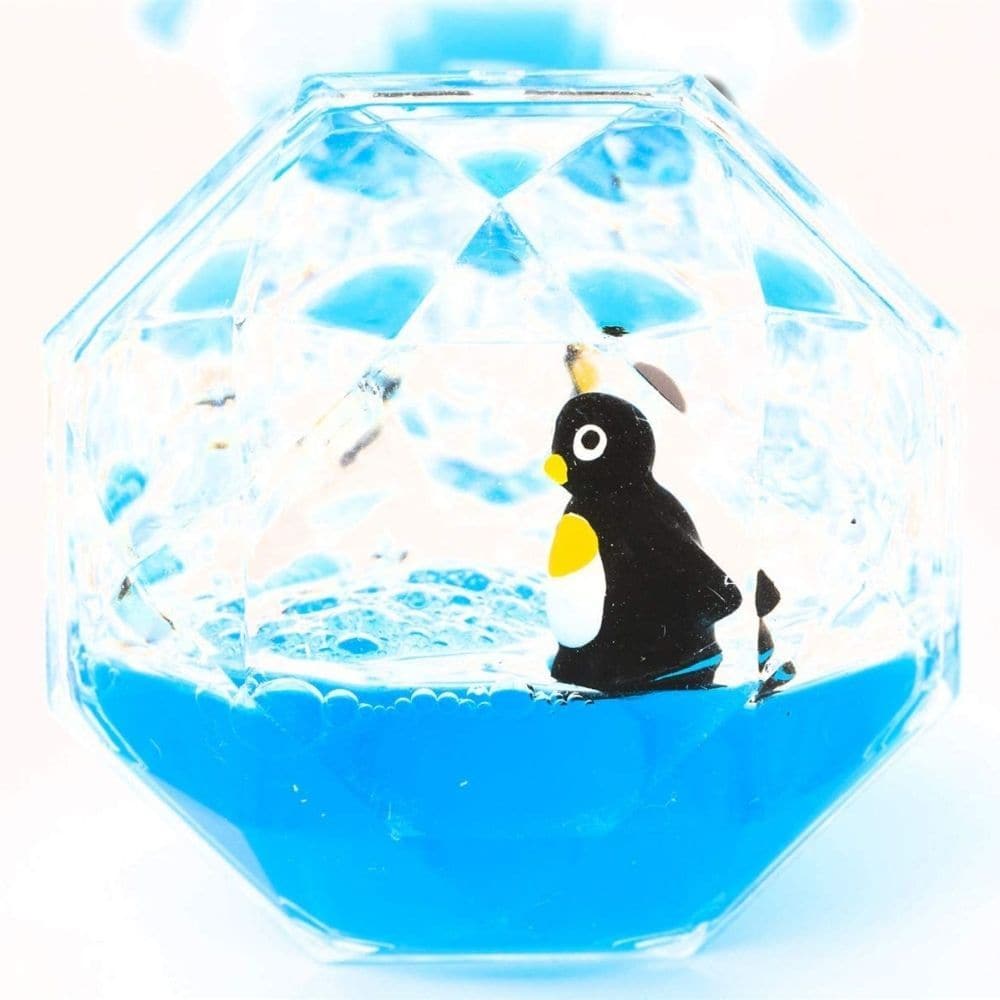 Penguin Liquid Timer, Watch penguins surf on a tide of colourful goo with this cool penguin liquid timer. Simply flip over the diamond shaped penguin liquid liquid timer to make the gloop gradually drip from the top half to the bottom half, with one penguin riding the wave down whilst the other rises up! Once the gooey liquid has completely drained from one side, flip it over and do it again. Hourglass liquid desk toy Blue goo moves from top half to bottom Penguins ride the gloopy waves Flip over to make th