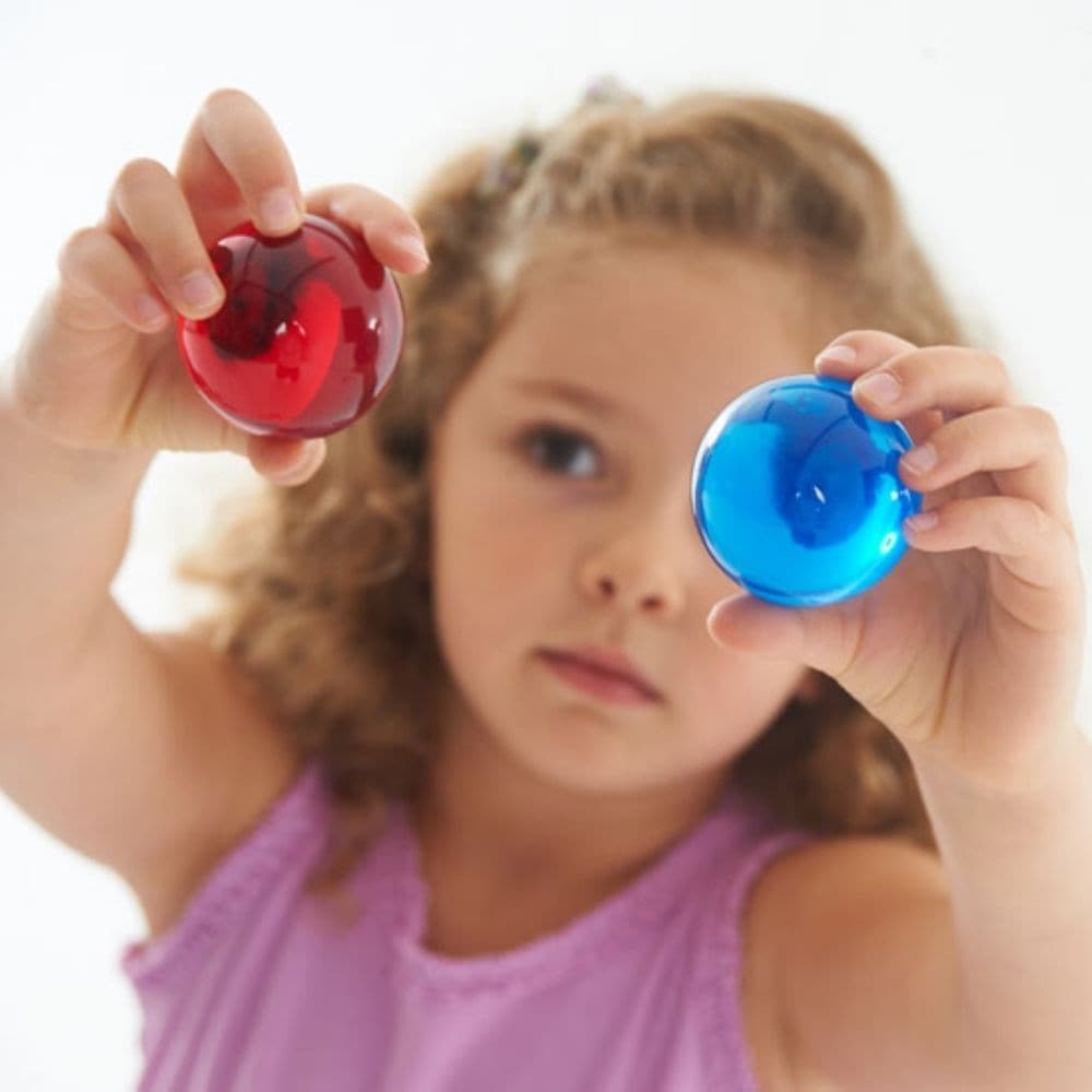 Perception Spheres Pack of 8, The Perception Spheres come in eight different clear colours and are soft and warm to the touch. The very youngest children will enjoy handling the Perception Spheres in free sensory play or a part of a Treasure Basket collection. Older children will find the Perception Spheres fascinating as they hold them up and look through them seeing the world around them in different colours. The way light behaves when children look through the Perception Spheres they will also see the wo