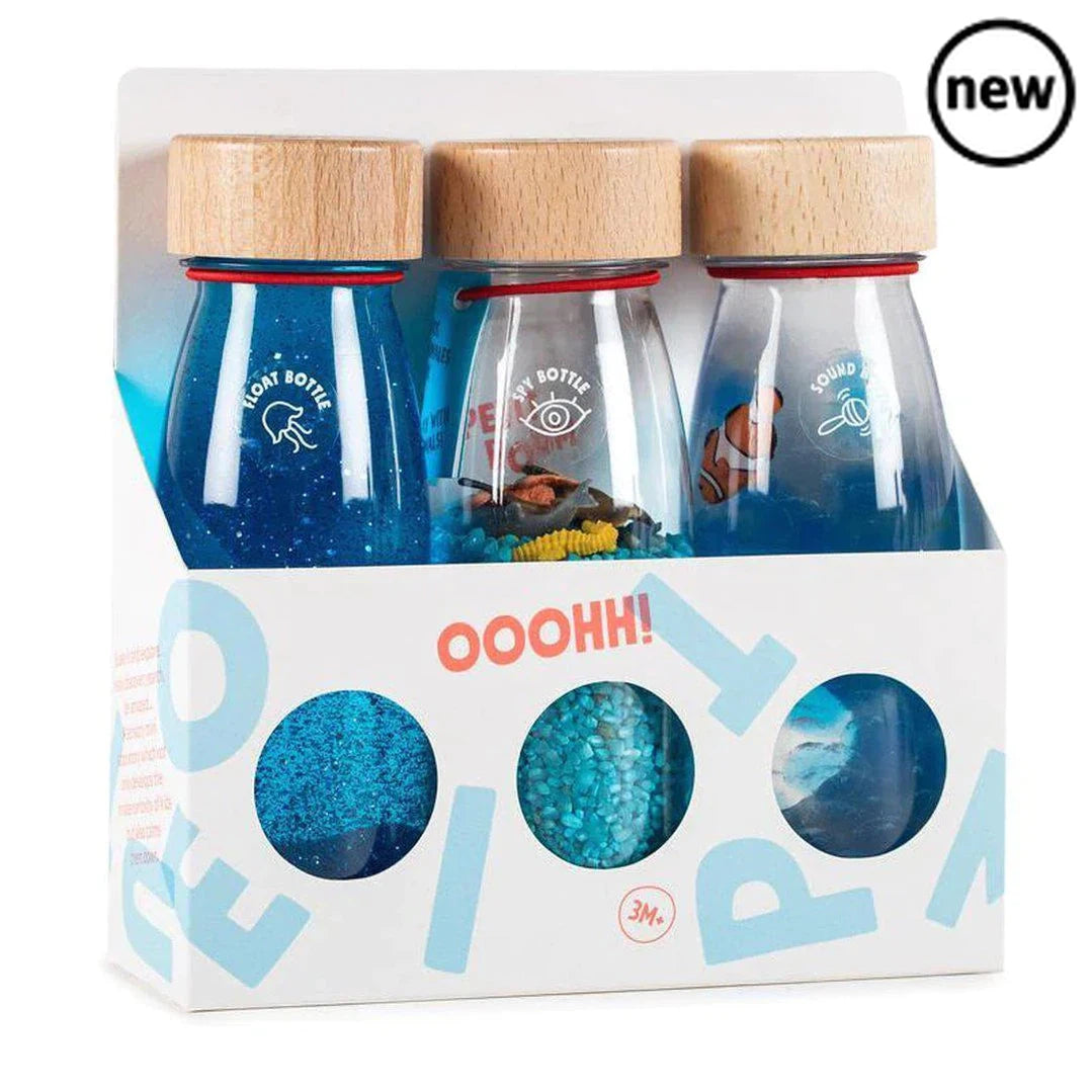 Petit Boum Sensory Bottle Pack Serenity, This is a best seller and it's clear to see why! Allow little ones to explore these three ocean inspired sensory bottles and let their imagination run wild. Can you find the clown fish? Shake, tip and turn the spy bottle to explore and talk through the different ocean creatures? Watch the glitter and pom poms gently dance in the beautiful blue liquid of the calming float bottle. Petit Boum Sensory Bottle Pack Serenity Great for: communication and language physical de