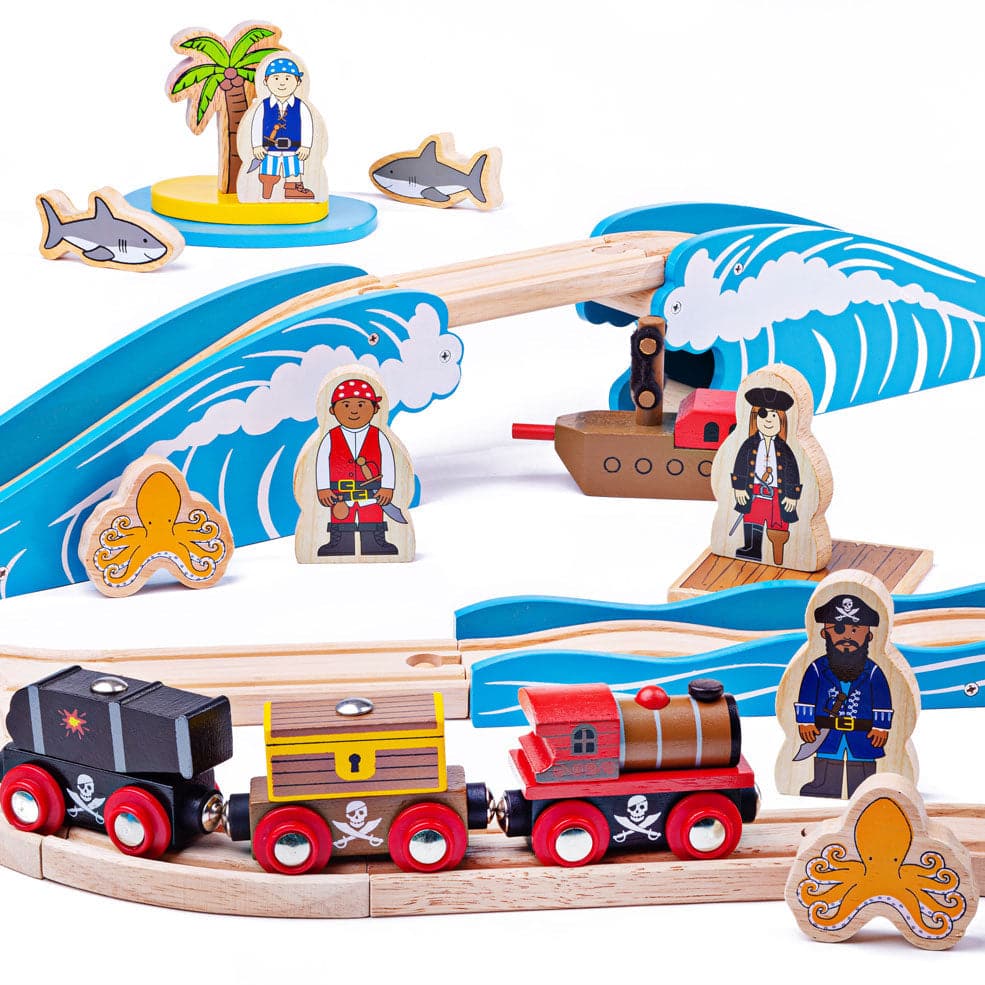 Pirate Train Set, Ahoy, me hearties! This Pirate Wooden Train Set is ready for your little one's swashbuckling adventure on the high seas! The pirate train includes two carriages carrying removable loads of a cannon and a treasure chest! Journey through the perilous landscape featuring bumpy track as you chug past stormy seas and a bridge to ride over the waves. Keep going past the desert island but beware of the shark and octopus-infested waters! Along the way, you'll meet shipwrecked pirates ready to stea