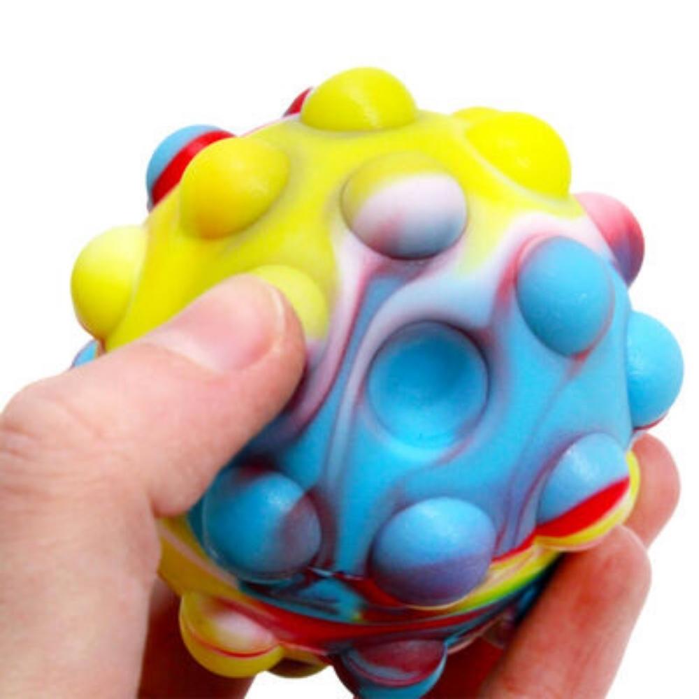 Pop N Squeeze Fidget Ball, The Pop N Squeeze Fidget Ball combines push popper fidget toys with a squishy, bouncy ball.This colourful Pop N Squeeze Fidget Ball pops just like reusable bubble wrap – and it bounces like a ball! Push the bubbles to see them pop! How many can you pop before they pop back out? The Viral TikTok Fidget Toy The hugely popular Toy Mania Fidget Pops Ball fidget toy is trending with popular Tik Tok users and social media influencers – and it’s so satisfying to pop! Available in 4 colou