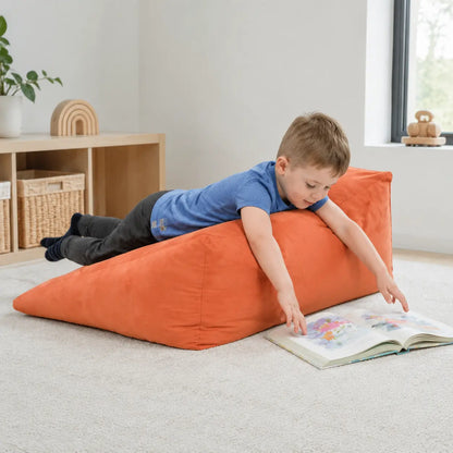 Prism Support Beanbag supported prone reading in a naturally lit early years nursery