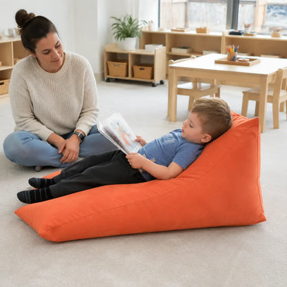 Prism Support Beanbag reclined quiet reading in a naturally lit early years nursery