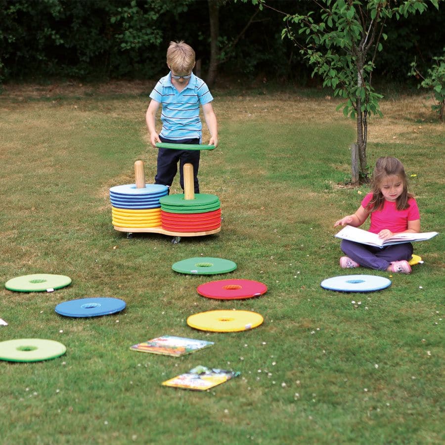 Rainbow Circular Mats & Donut Trolley, The Rainbow Circular Mats & Donut Trolley Set consists of 32 circular cushions which are ideal for group work. The Rainbow Circular Mats fit neatly onto the wooden trolley supplied to store away the Rainbow Circular cushion's when not in use. Brightly coloured soft circular mats suitable for indoor and outdoor use with handy storage trolley. Set of 32 versatile mats which are suitable for indoor and outdoor use. Mats are washable at 30°C to help maintain an hygienic cl