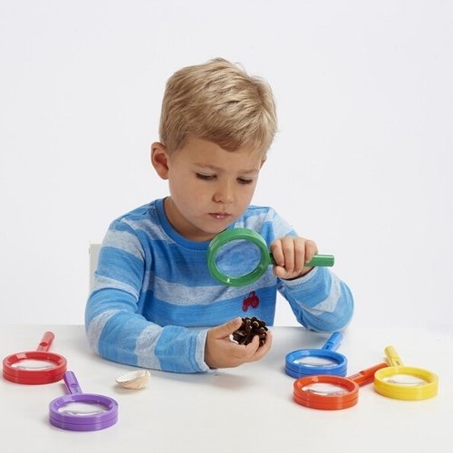 Rainbow Magnifiers Pack of 6, TickiT® Rainbow Magnifiers are the perfect size for small hands. The brightly coloured hand magnifiers are an ideal way for your child to examine and investigate items from their natural environment, such as leaves, soil, natural patterns and insects.The lens enables up to 3x magnification for close up inspection.Rainbow Magnifiers Set includes: 6 magnifiers in 6 colours (red, blue, yellow, orange, green, purple).Size: L 16cm x 8cm diameter.Age: Not suitable for children under 