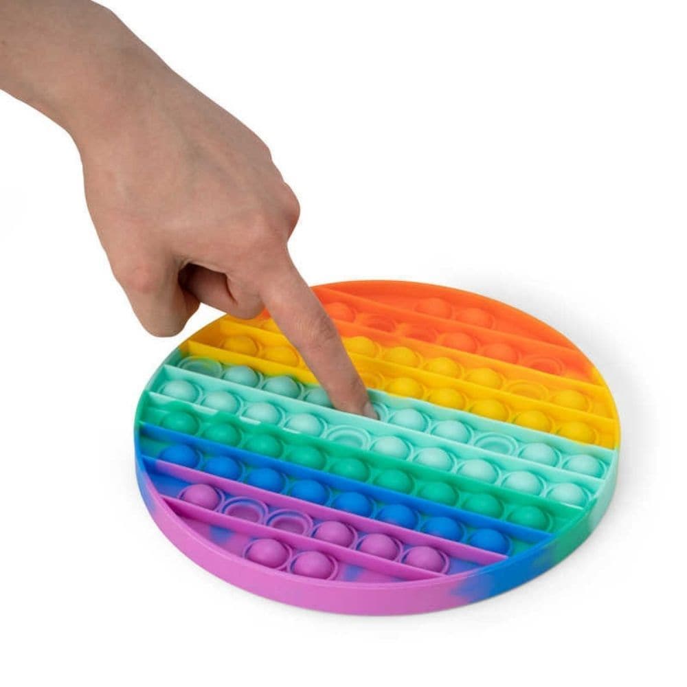 Rainbow Push Popper Jumbo Mat, Extra large version of our best-selling Rainbow Push Popper. This rainbow coloured pad is covered in bubbles that make a satisfying pop sound when pushed inwards, similar to bubble wrap. After one press, the bubble then appears on the other side, ready to be pushed and popped all over again. This fiddle toy is immensely satisfying to use, and is proving to be a big hit with popular Tik Tok users and other social media influencers. Large plastic pad with popping bubbles Trendin