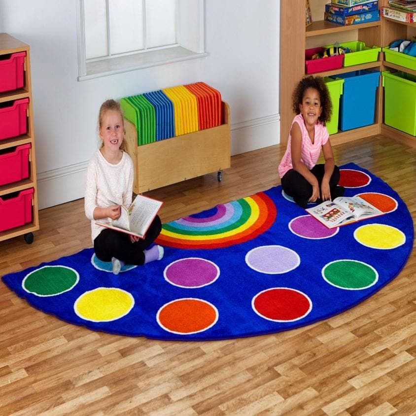 Rainbow Semi Circle Classroom Carpet, This highly colourful Rainbow™ Semi-Circle Placement Carpet features 13 placement spots and 1 teacher spot making it the perfect addition to any reading area or simply as a bright new colourful addition to any classroom. This highly colourful semi-circle placement carpet features 13 placement spots and 1 teacher spot. Great for reading areas or just a bright addition to the classroom environment. Carpet features: Distinctive and brightly coloured, child friendly designs