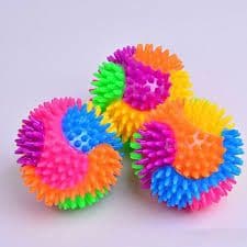 Rainbow Spikey Ball Light Up, The Rainbow Spikey Ball Light Up is one colourful stress ball with a spikey texture to match! This rubbery, spiked-out, light-up ball is great for relieving your stress and for adding colour to your sensory collection, while at the same time the spikes will hit all the relaxing pressure points when you grab and squeeze it. To help you relax during a stressful moment, bounce the ball to activate its flashing light show. Then, watch the colourful blinking lights, zone out, and fo