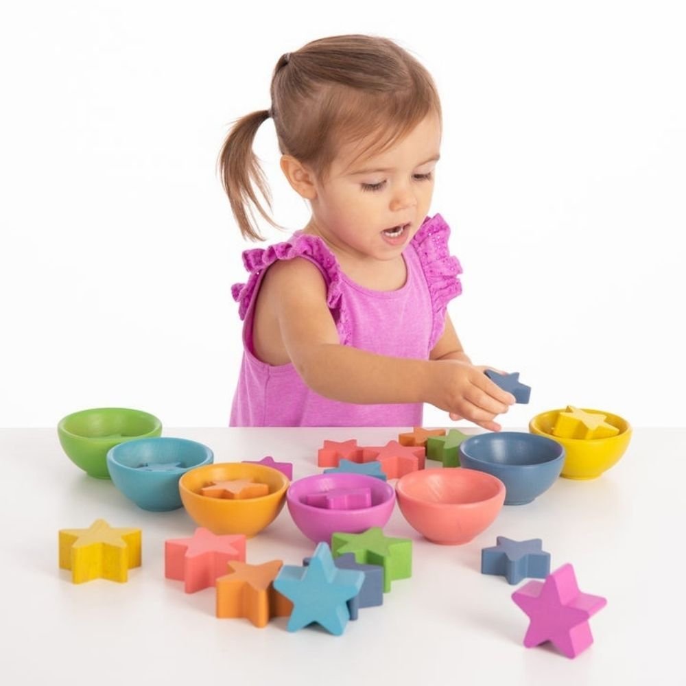 Rainbow Wooden Stars, Our TickiT® Rainbow Wooden Stars are made from beautiful beechwood with a natural woodgrain finish in the seven colours of the rainbow, and in differing sizes and thickness. These chunky wooden star pieces are perfect for children to handle and learn about colour and shape, whilst having fun learning to count, sort, stack and sequence. As your child plays they will be developing their manual dexterity and fine motor skills as well as supporting early numeracy and colour recognition. Fo