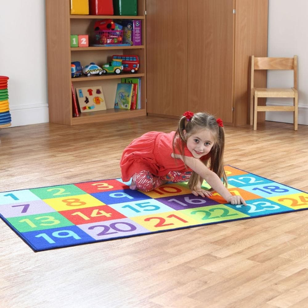 Rainbow™ 1-24 Numbers Carpet, The Rainbow™ 1-24 Numbers Carpet is a brightly coloured, 1 to 100 number carpet which is great for basic group numeracy skills. The Rainbow™ 1-24 Numbers Carpet is a great resource for interaction and play. The 1- 24 Numbers carpet is a colourful and stylish resource and will bring learning to your setting in a fun and engaging way. Why Choose The Rainbow 1-24 Classroom Number Mat ? A classroom essential for number recognition and learning basic numeracy skills. Light and durab
