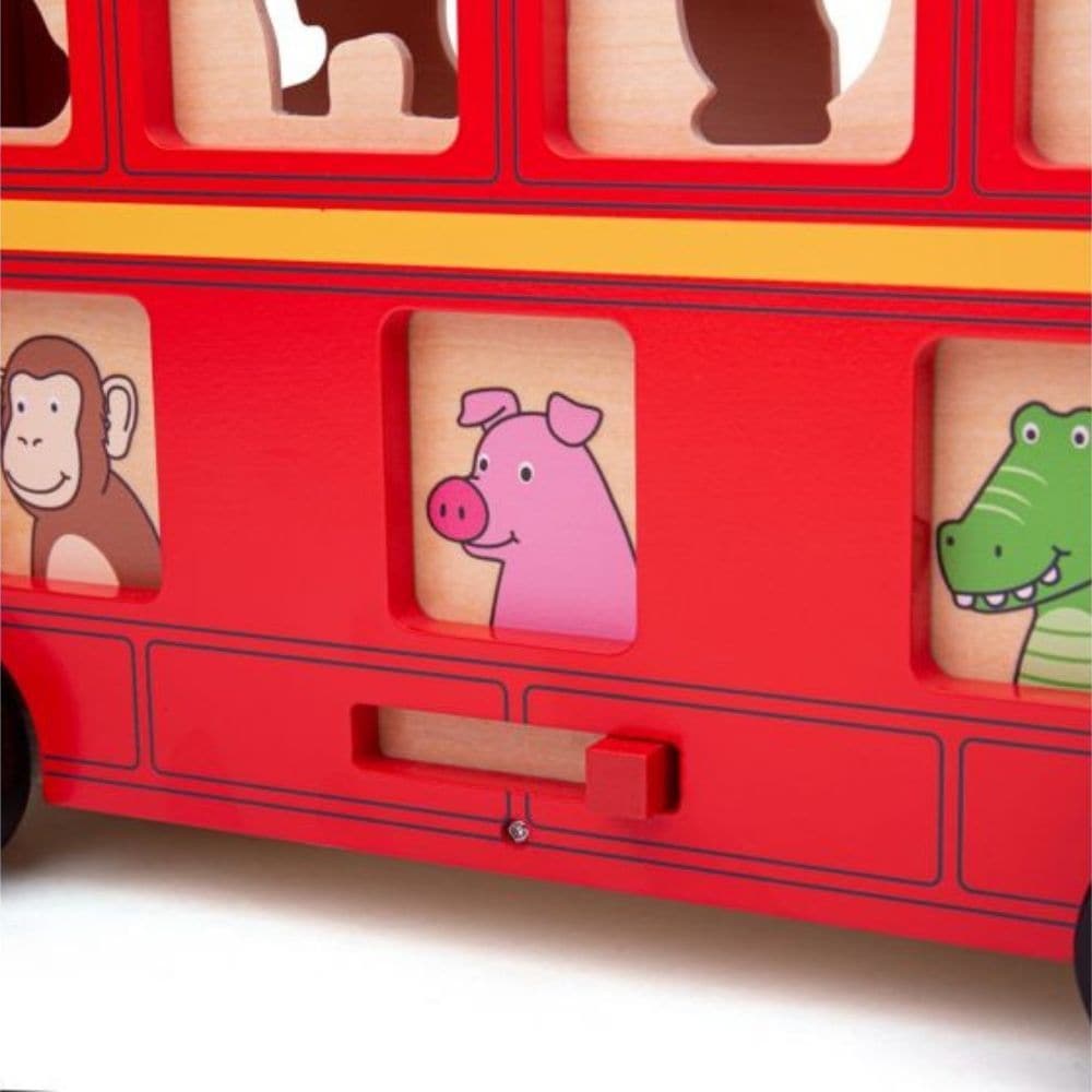 Red Bus Sorter, The Bigjigs Red Bus Sorter is a charming and multifaceted wooden toy designed to captivate young minds while offering a host of educational benefits. Crafted with attention to detail, this vibrant red bus comes complete with wooden animal figures that serve as its passengers. Educational Benefits of the Red Bus Sorter: Motor Skills: Posting the animals through their corresponding slots helps children hone their fine motor skills. Cognitive Development: Identifying the correct slots for each 