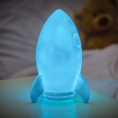 Rocket Night Light, Illuminate your child's nights with this delightful Rocket Night Light. Equipped with a colour change LED, this light gently shifts from one colour to the next, creating a calming and mesmerizing light show, suitable for any child's room. Features of the Rocket Night Light: Design: Shaped like a sweet rocket, appealing to children’s imagination. Lighting: Lit by a colour change LED that scrolls through various colours. Safety: Remains cool to the touch, ensuring it’s safe for even the sm