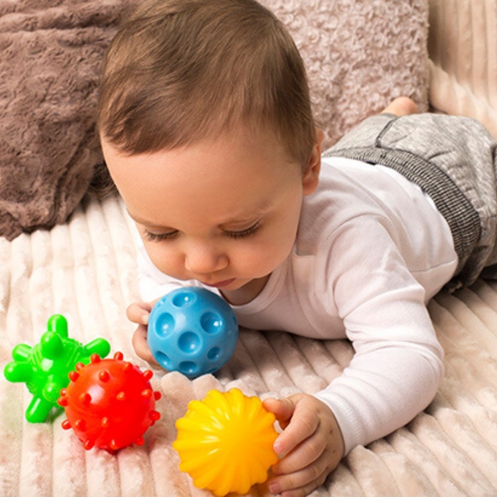 Sensory Balls 4 Pieces, A set of four soft sensory balls designed for sensory integration exercises and fun. Each Sensory ball has a different size and texture, thanks to which it provides a different sensory experience. These sensory balls do not have a hole, so they are great during bathing. Water does not get inside, and children only come in contact with the outer layer of the toy. It's even more hygiene for your toddler. They provide tactile sensations by using different material structures, which impr