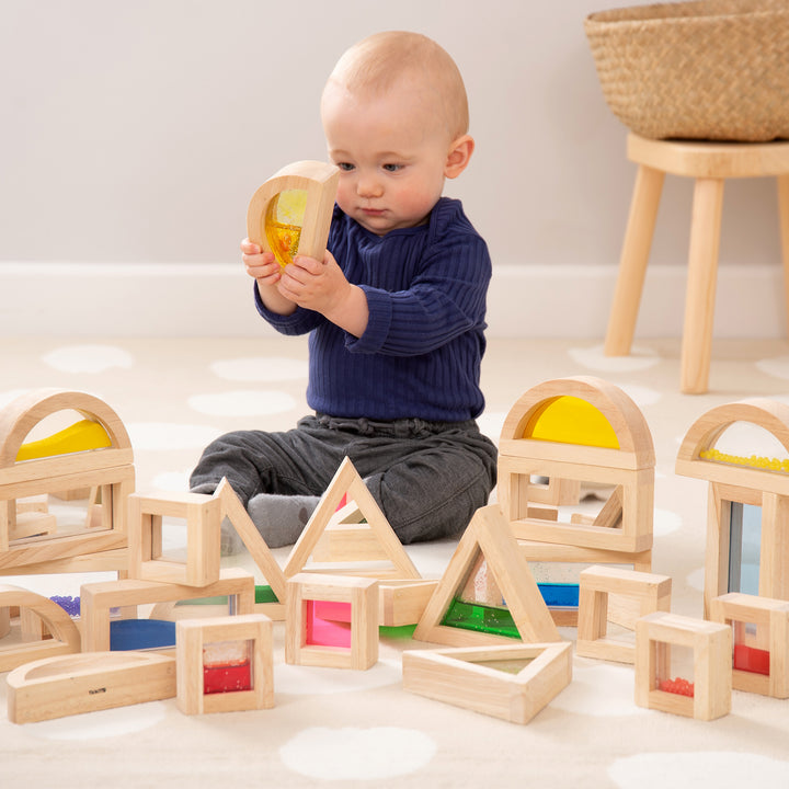 Sensory Blocks, The sensory blocks come in an amazing set of 16 large blocks made from fine hardwood and designed to last with a very high quality fun and colourful design. The sensory blocks are chunky wooden blocks comprising four different shapes, four different colours and four different inserts of sand, water, beads and coloured acrylic. Ideal as a set of building blocks. The sensory Blocks provide many different visual experiences for the user to enjoy. The sensory blocks package contains 16 various b