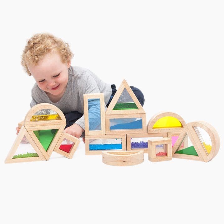 Sensory Blocks, The sensory blocks come in an amazing set of 16 large blocks made from fine hardwood and designed to last with a very high quality fun and colourful design. The sensory blocks are chunky wooden blocks comprising four different shapes, four different colours and four different inserts of sand, water, beads and coloured acrylic. Ideal as a set of building blocks. The sensory Blocks provide many different visual experiences for the user to enjoy. The sensory blocks package contains 16 various b