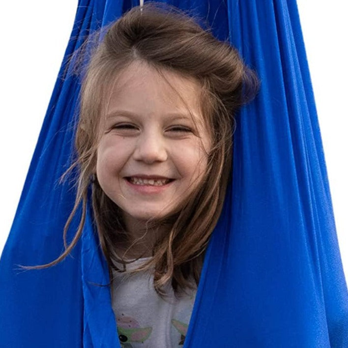 Sensory Hug Swing, Introducing the Sensory Hug Swing - a one-of-a-kind sensory experience designed to provide children with a calming and soothing environment. Crafted from soft yet durable lycra, this swing molds to the user's body and can withstand even the heaviest of use.The Sensory Hug Swing offers a multitude of benefits for children of all abilities. It serves as a relaxing space for kids to unwind and calm down, providing a deep squeeze sensation and gentle movement that enhances their sensory input