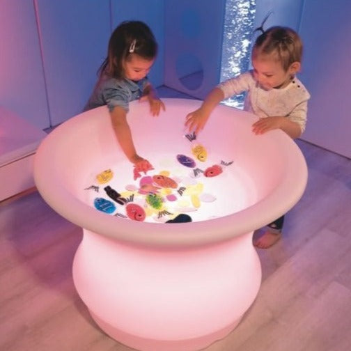 Sensory Mood Water Table, The new colour-changing Sensory Mood Water Table brings a whole new perspective to water exploration and sensory play. The Sensory Mood Water Table provides a soft light that changes colour using the remote control, the well can be filled with water, jelly, foam or translucent objects for a wide variety of ways to explore light, colour and sensory play. The sturdy but lightweight Sensory Mood Water Table design is beautiful as well as practical: it can be moved easily between locat