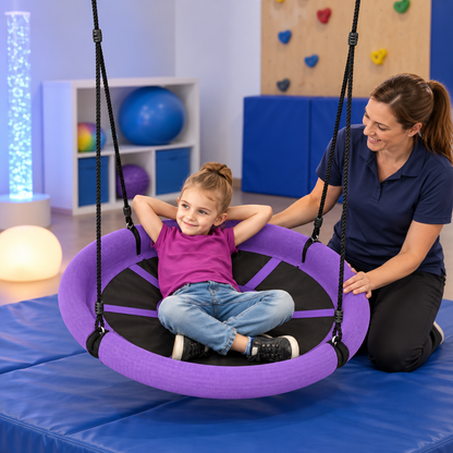 Purple Sensory Nest Swing in an occupational therapy room