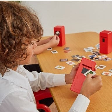 Shape Posting Game, The Shape Posting Game features 4 brightly coloured ‘post-boxes’ and 40 individual double-sided picture cards, with real life photos on! Each photo contains one dominant shape, and children are encouraged to sort the photos into their corresponding boxes. This is improving their shape recognition and sorting skills. Once the pictures are sorted, you can create simple counting games and activities for them by grouping the different shapes together! The shape posting game is a fantastic re