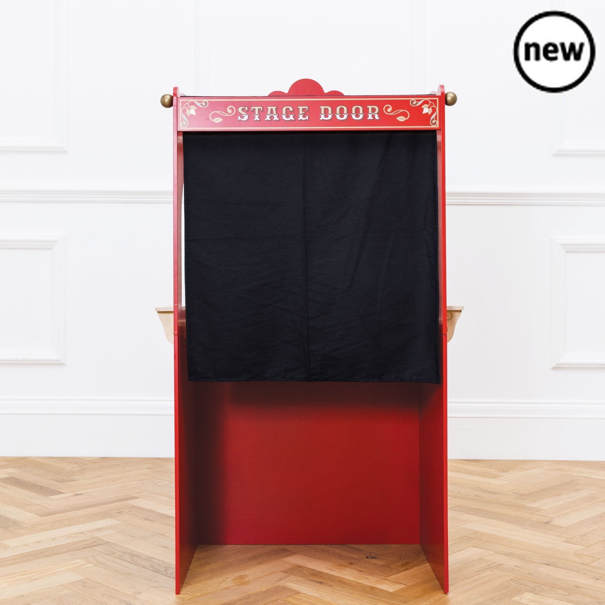 Showtime Puppet Theatre, Description The stage is set for roleplay fun! This amazing retro wooden puppet theatre toy is a real showstopper. With it's unique nostalgic design and brightly painted exterior, crafted from durable, sustainable wood. Little performers will adore this interactive toy, crammed with many realistic features to inspire imaginative learning. With a reversible sign, stage door and two chalk boards to display up and coming acts. For dramatic effect, we've included a pair of beautiful red