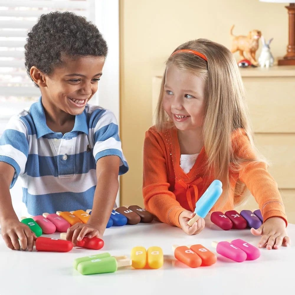 Smart Snacks Alpha Pops, Introduce your little ones to the world of letters with Smart Snacks® Alpha Pops™! This engaging, colourful set of popsicle-shaped toys makes learning the ABCs fun and interactive. Designed for both classroom and home use, Alpha Pops offer multiple ways to educate and entertain. Smart Snacks Alpha Pops Features: Alphabet Learning Each of the 26 double-sided pops features an uppercase letter on one side and its lowercase counterpart on the other, making it a wonderful tool for teachi
