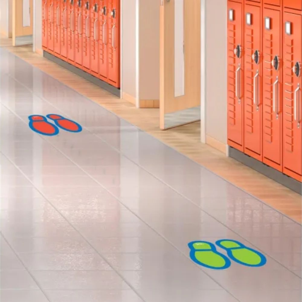 Social Distancing Floor Decals - Footprints, These brightly coloured, durable footprint decals can be used in busy indoor and outdoor zones as a visual reminder on where to stand for social distancing. The set includes decals in 4 bright colours: red, green, orange, and blue. These decals can be used on several different surfaces including concrete, tile, and loop pile carpet. Use these brightly coloured footprint decals to show people where to stand to maintain social distancing. Set includes 8 pairs of so